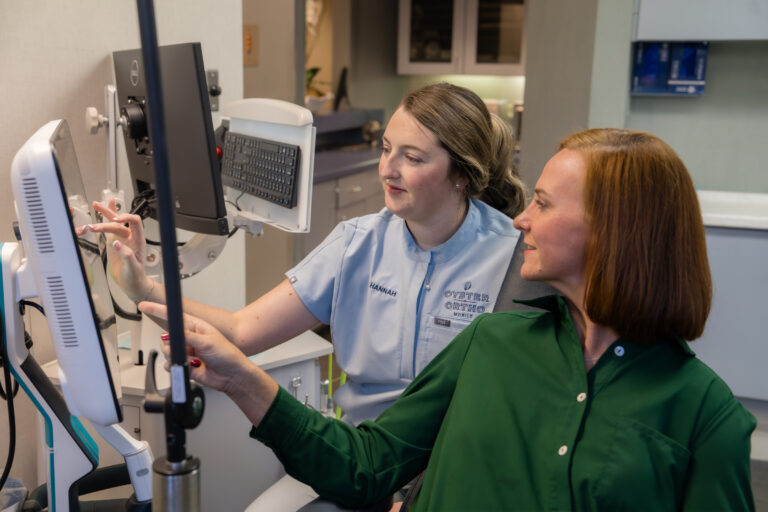 Patient and team member using orthodontic technology for braces in Mobile AL
